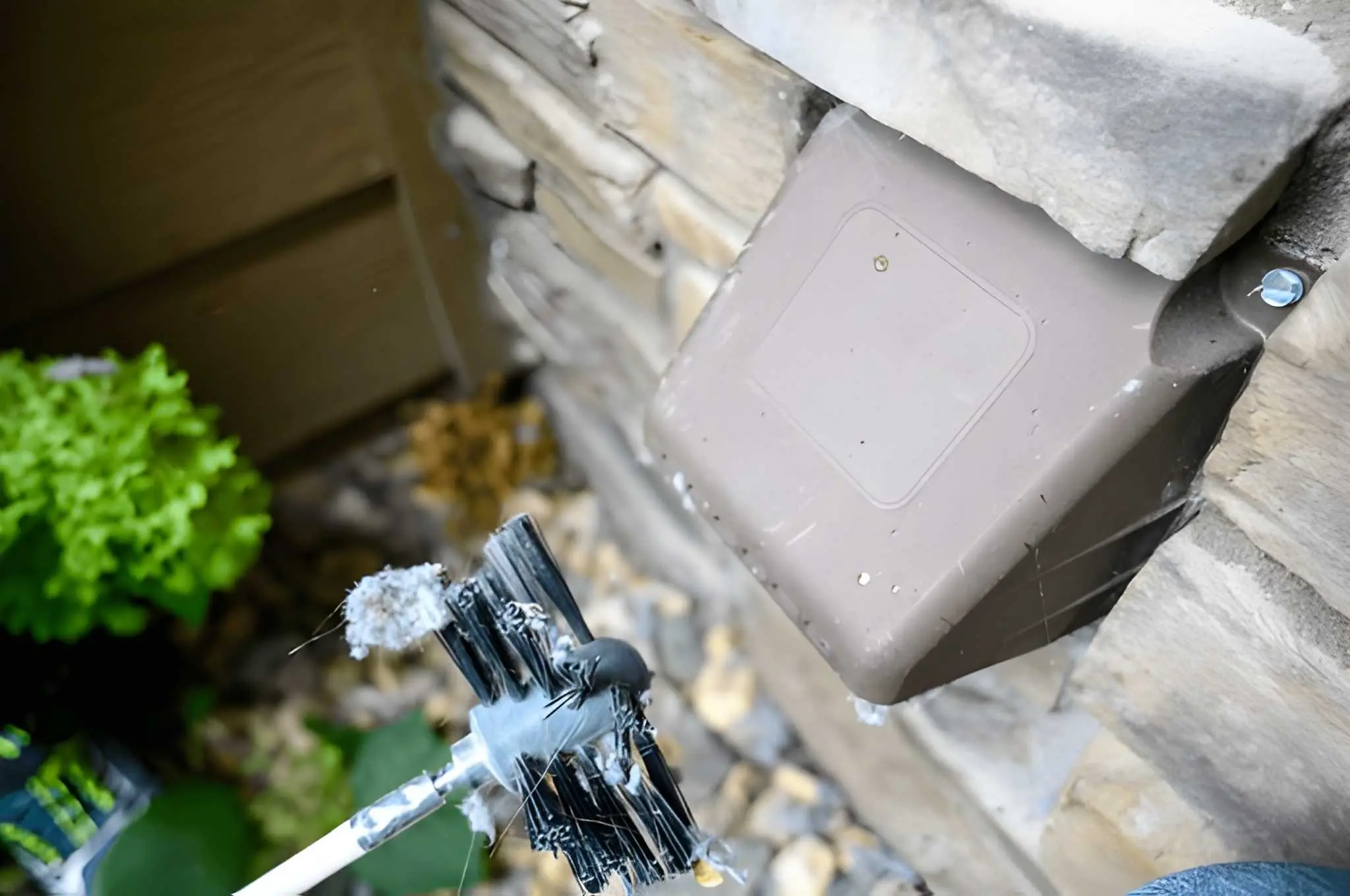 Technician performing professional Dryer Vent Cleaning in Manhattan Beach for a residential home