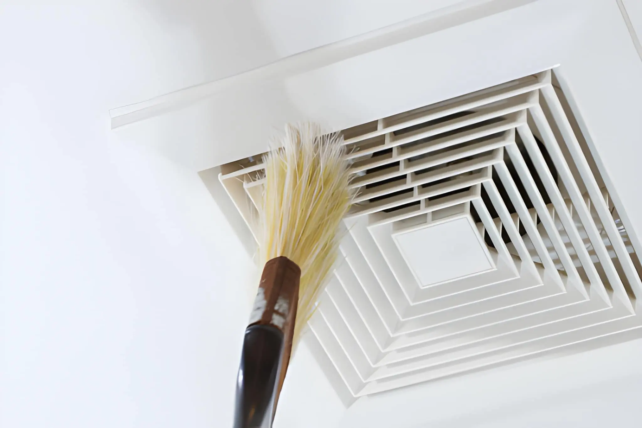 Professional AC Vent Cleaning technician inspecting residential vents